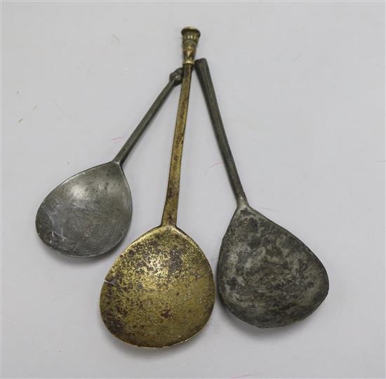 Two 17th century pewter spoons and a Charles II brass spoon